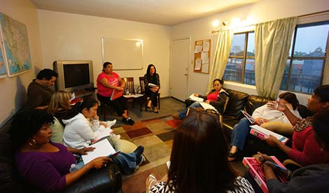 room full of people in a discussion