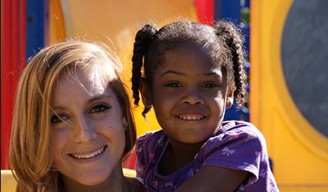 woman and little girl posing for the camera