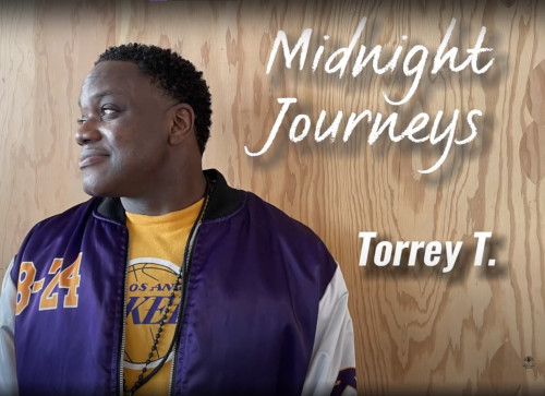 Portrait of Torry T. smiling at The Midnight Mission in Los Angeles, representing community support and recovery services.