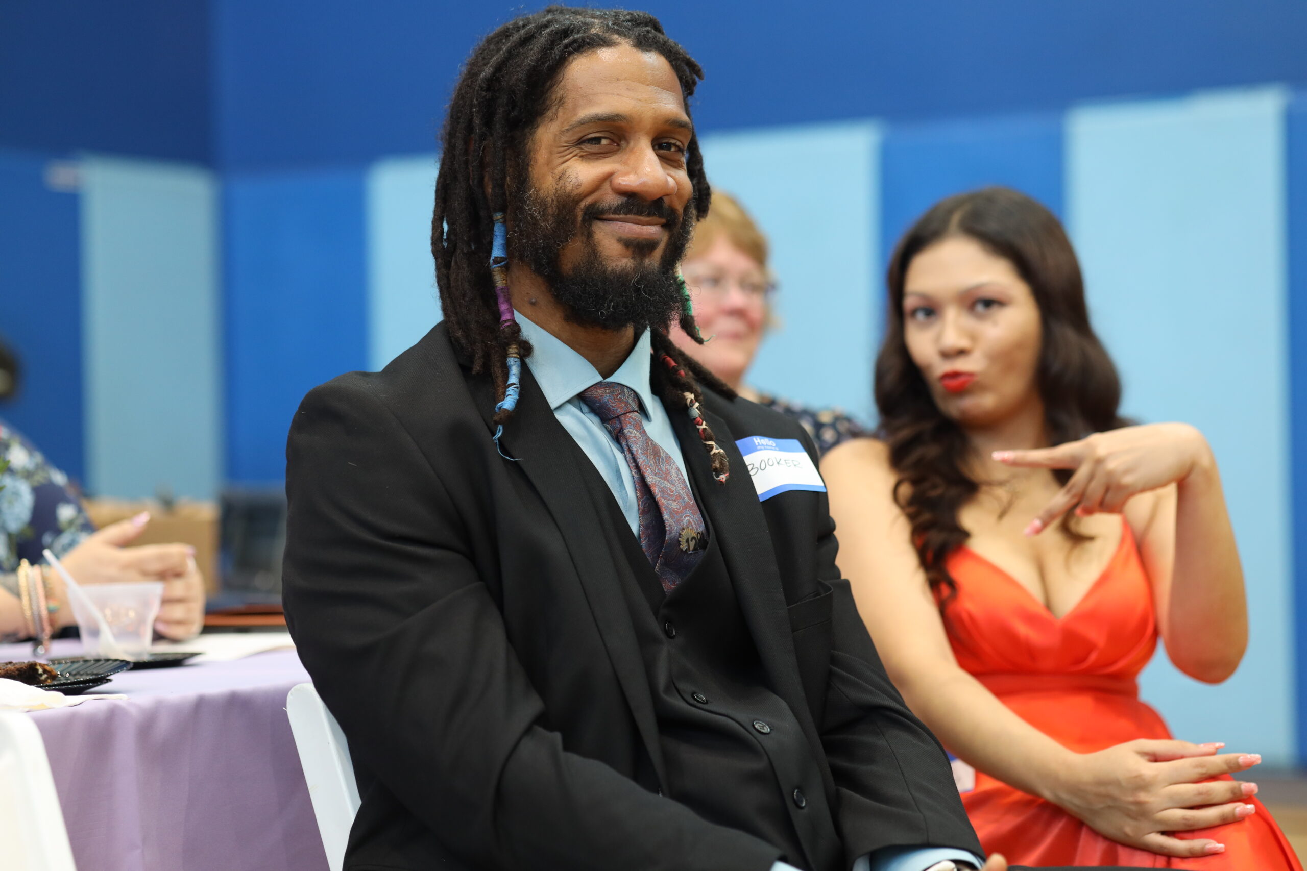Booker, A Midnight Mission Alum, Smiles Gladly At A Graduation Ceremony As A Woman Beside Him Poses Playfully