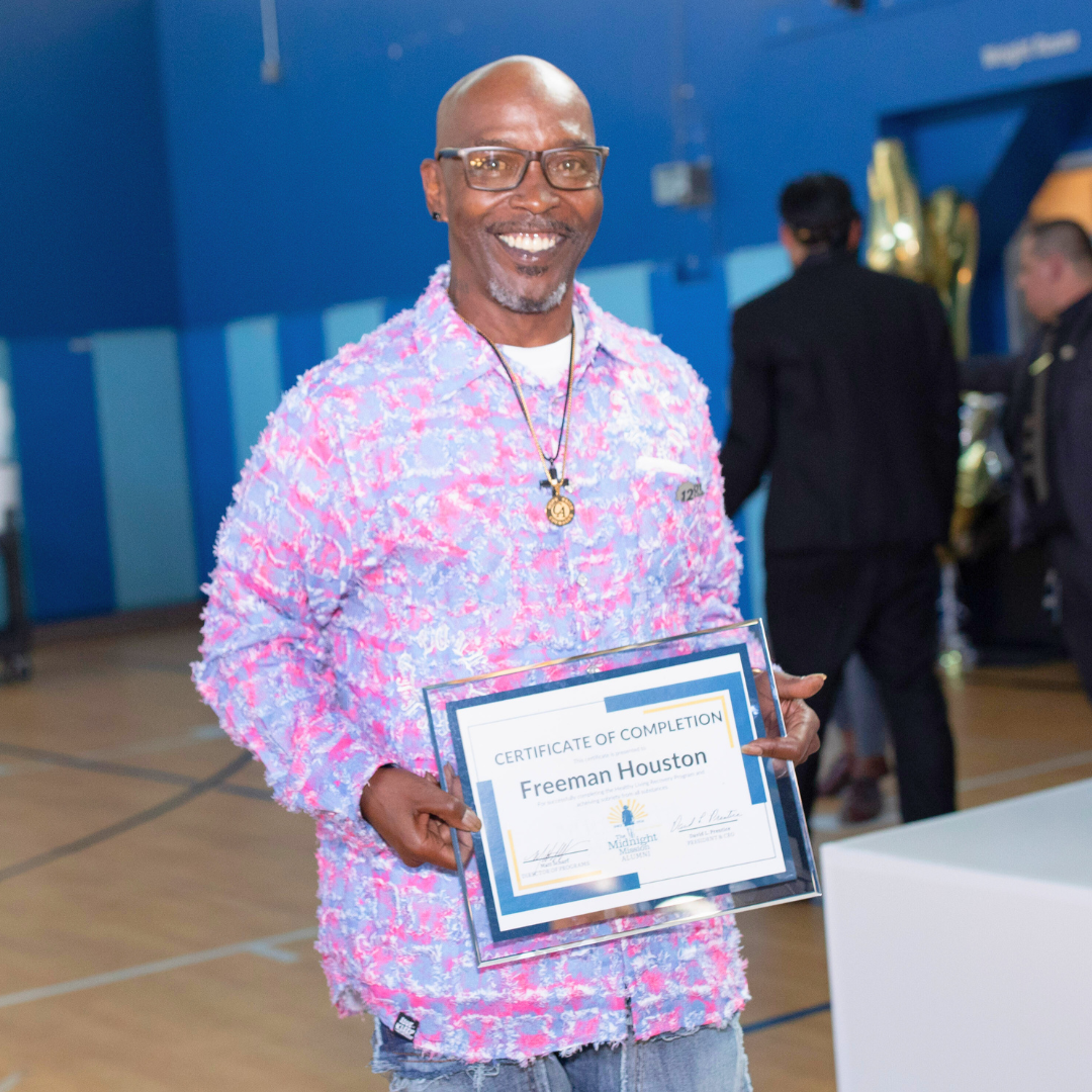 Freeman Houston Smiles While Holding His Certificate Of Completion At A Midnight Mission Graduation Event